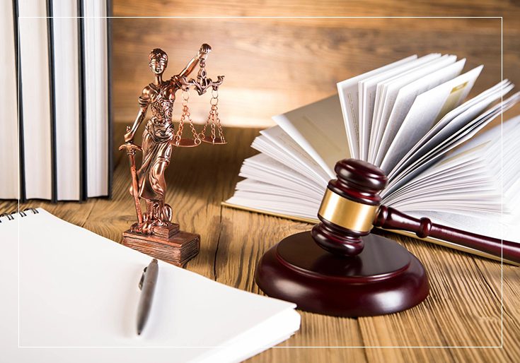 A wooden gavel sitting on top of a table.