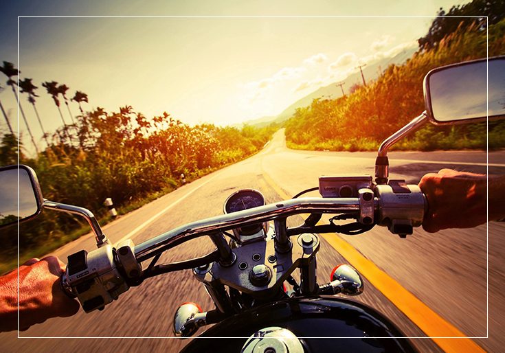 A person riding on the back of a motorcycle.