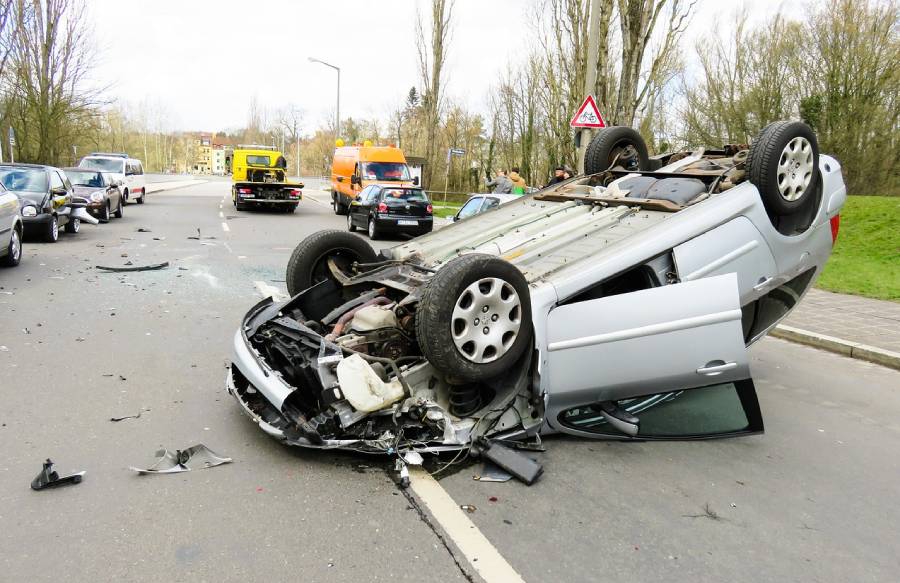 A car that is sitting on the side of a road.