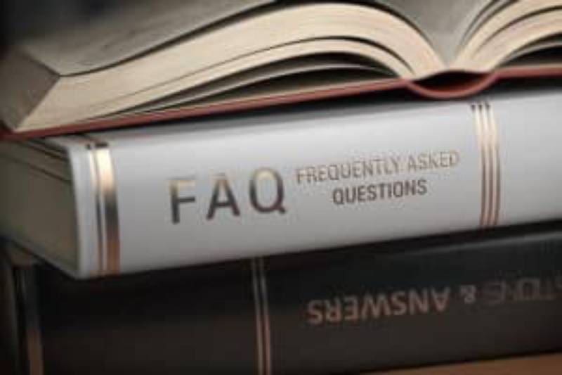 A stack of books with the words faq on them.